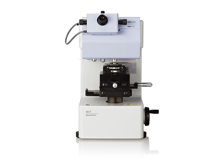A New-Concept Compression Testing Machine for Evaluating the Strength of Micro Materials